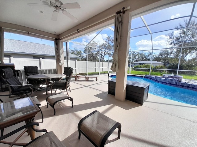 exterior space with a lanai, ceiling fan, and a patio area