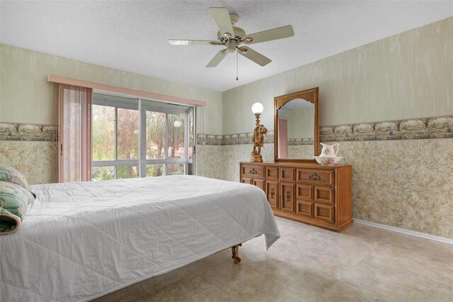 bedroom featuring a textured ceiling and ceiling fan