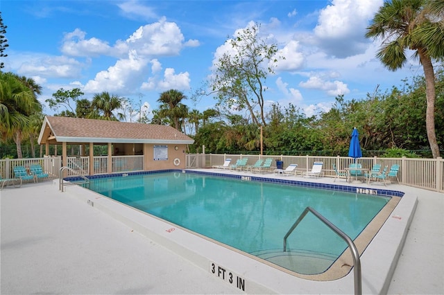 view of swimming pool featuring a patio