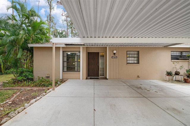 property entrance featuring a patio area