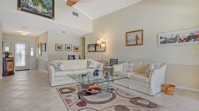 tiled living room featuring ornamental molding and high vaulted ceiling