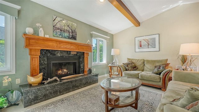 living room with lofted ceiling with beams and a premium fireplace