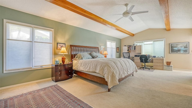 bedroom with light carpet, ceiling fan, a textured ceiling, and multiple windows