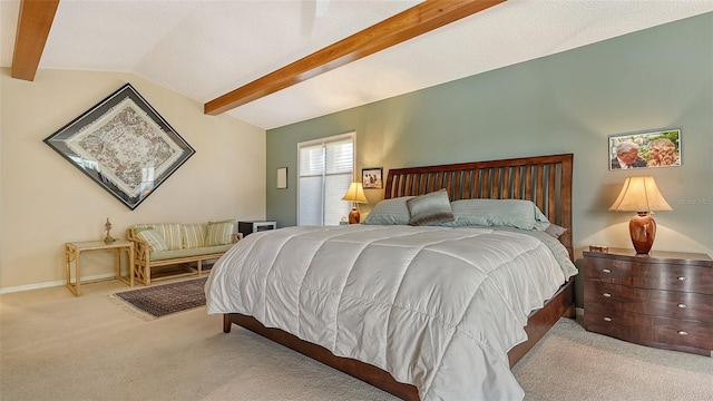 carpeted bedroom featuring lofted ceiling with beams