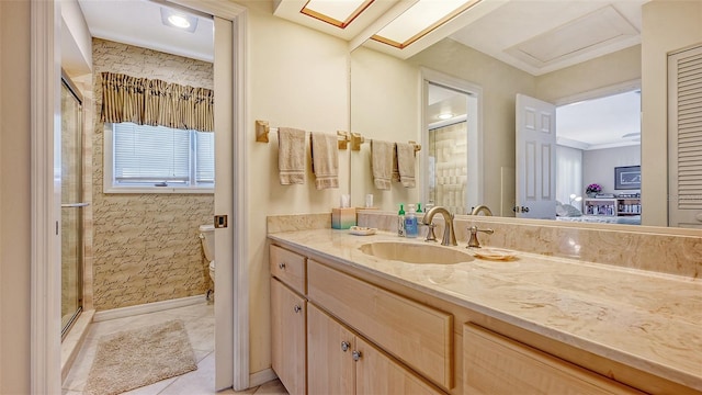 bathroom featuring toilet, vanity, tile patterned flooring, and a shower with shower door