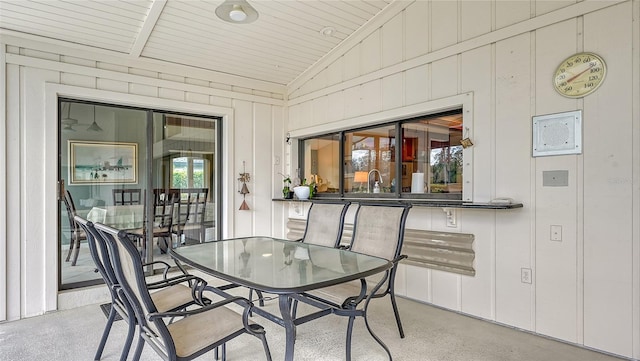 dining area featuring lofted ceiling