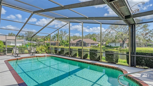 view of pool featuring a patio area and glass enclosure