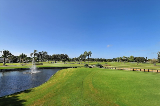 view of community featuring a yard and a water view