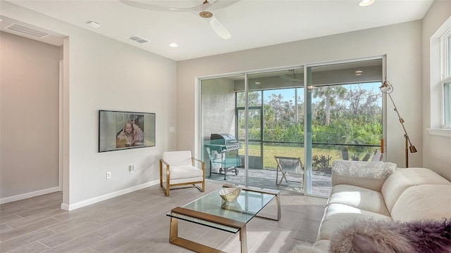 interior space with ceiling fan and light hardwood / wood-style floors