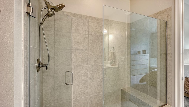 bathroom with a shower with shower door