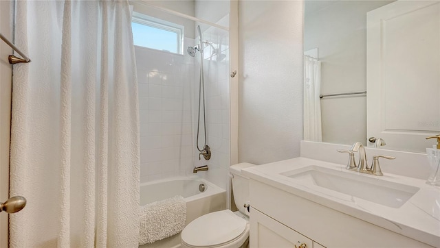 full bathroom featuring vanity, shower / bath combination with curtain, and toilet