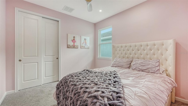 bedroom featuring carpet floors, ceiling fan, and a closet