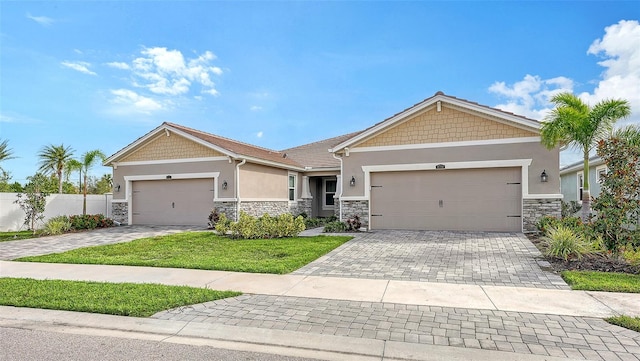 view of front facade with a garage and a front yard