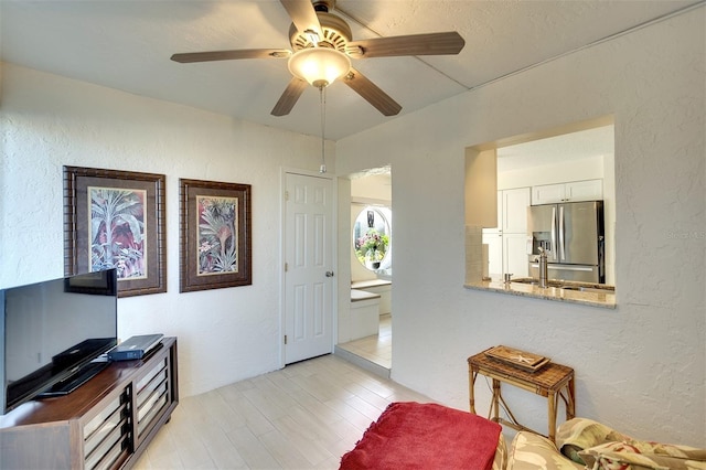 interior space featuring ceiling fan