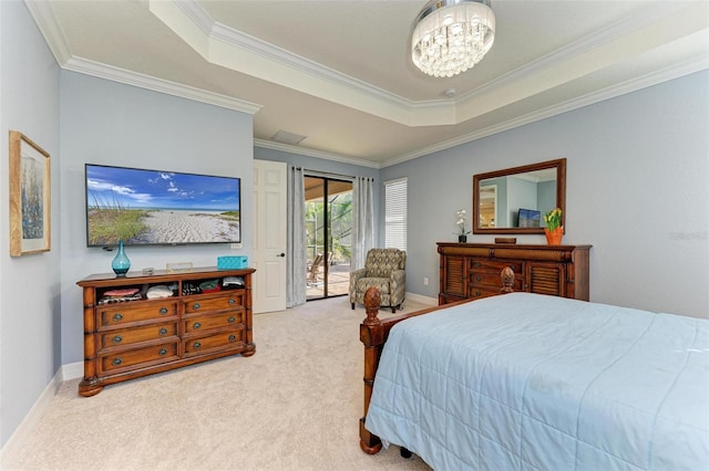 carpeted bedroom featuring access to outside, a raised ceiling, crown molding, and a chandelier