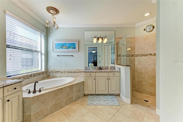 bathroom featuring vanity, ornamental molding, and a textured ceiling