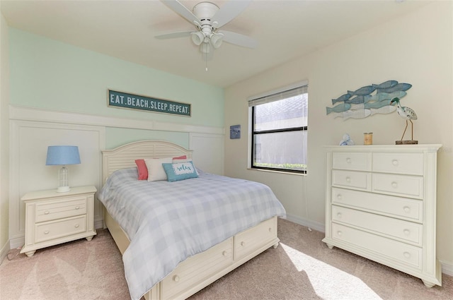 bedroom featuring ceiling fan and light colored carpet