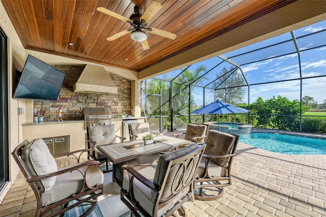 view of patio featuring glass enclosure, area for grilling, a swimming pool with hot tub, and ceiling fan