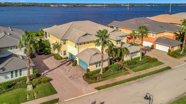 birds eye view of property with a water view