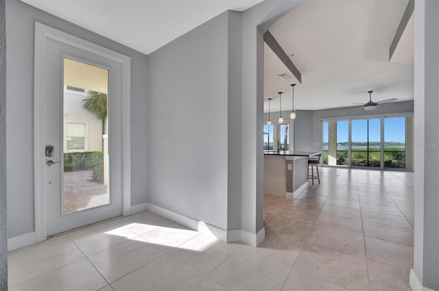 interior space featuring ceiling fan