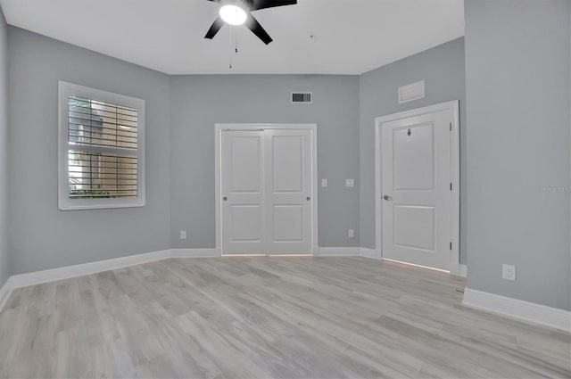 unfurnished bedroom featuring ceiling fan and light hardwood / wood-style flooring