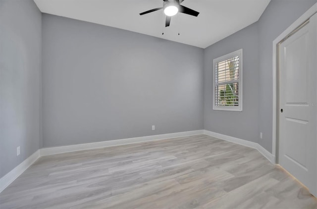 spare room with light hardwood / wood-style floors and ceiling fan