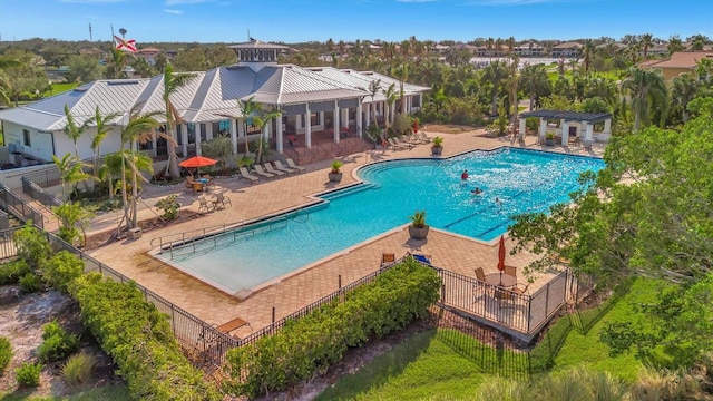 view of swimming pool featuring a patio area and a pergola