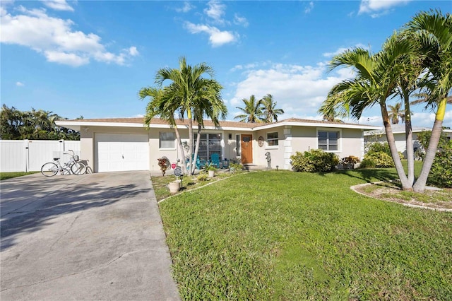 single story home featuring a garage and a front yard