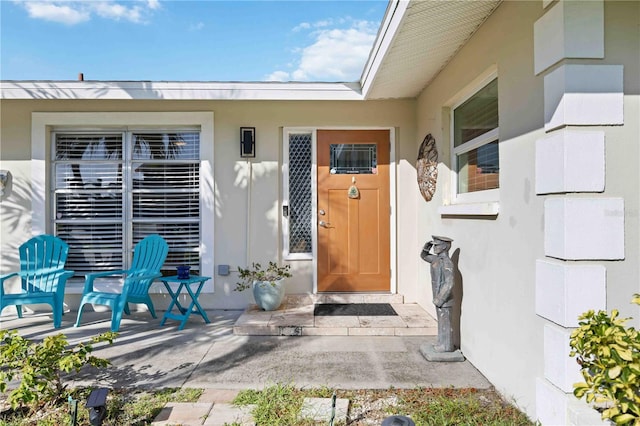 property entrance with a patio