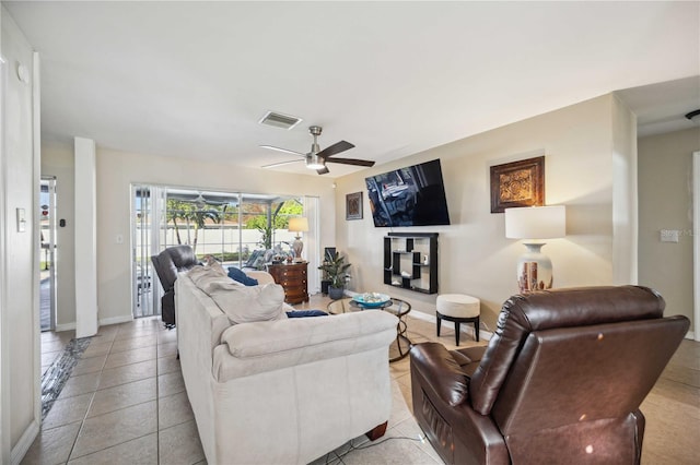 living room with ceiling fan and light tile patterned floors