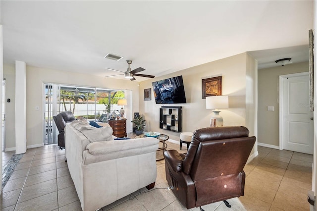 living room featuring ceiling fan and light tile patterned floors