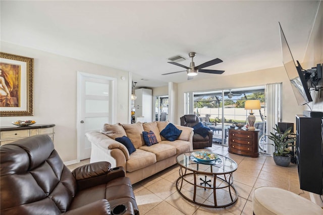 living room with light tile patterned floors and ceiling fan