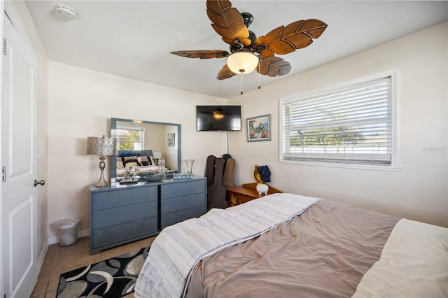 bedroom featuring tile patterned flooring and ceiling fan