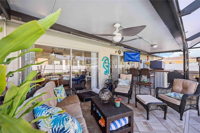 view of patio / terrace featuring ceiling fan and an outdoor living space