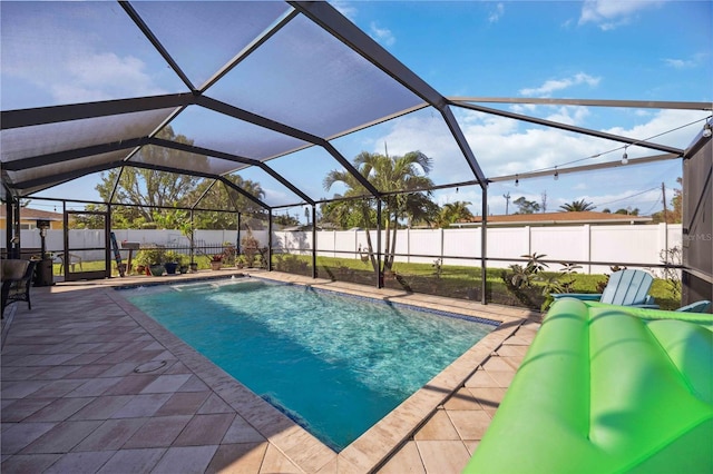 view of pool with a patio and a lanai