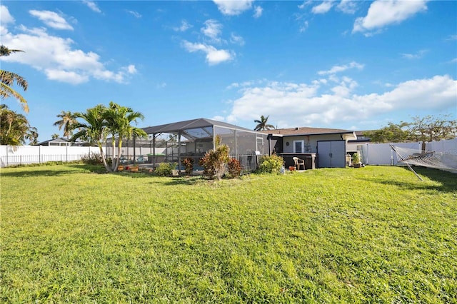 view of yard with glass enclosure