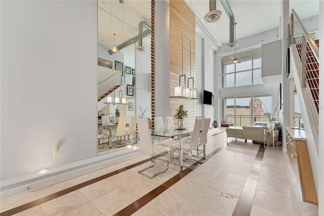 1990 Main St Unit 15, Sarasota, FL 34236 - lobby featuring a towering ceiling and stairway