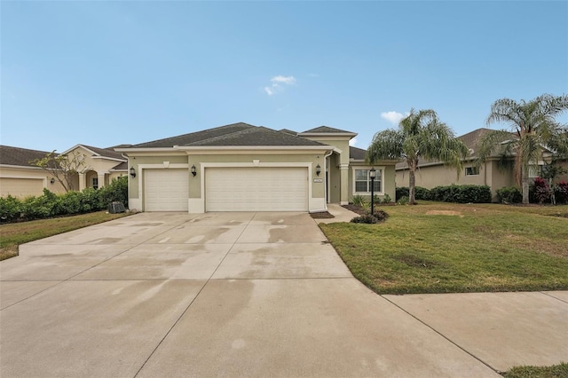 ranch-style home featuring a garage and a front yard