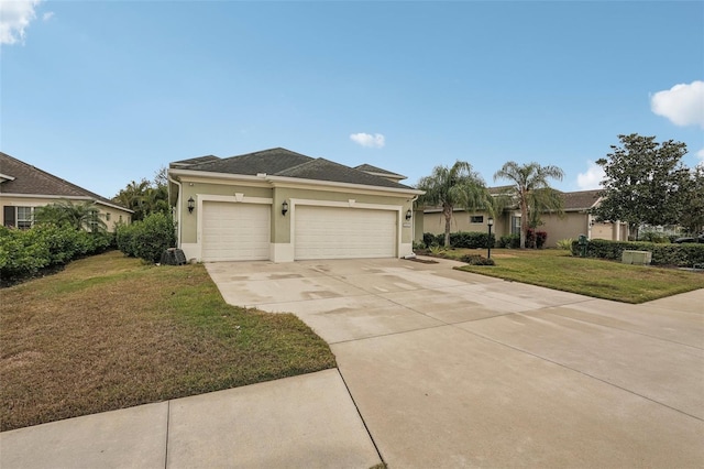 view of front of property with a front yard and a garage