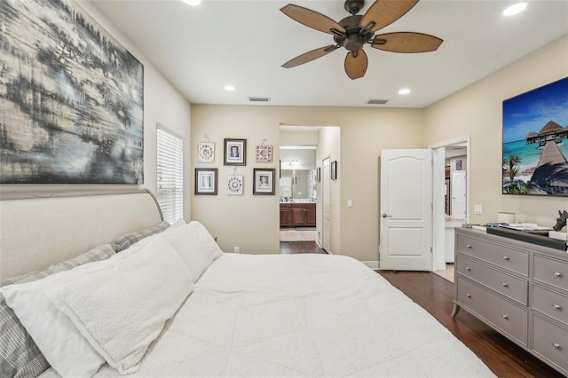 bedroom with dark hardwood / wood-style flooring, connected bathroom, and ceiling fan