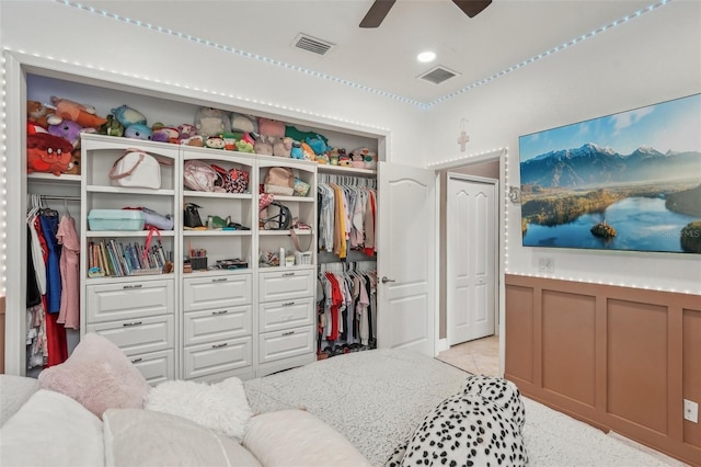 walk in closet featuring ceiling fan