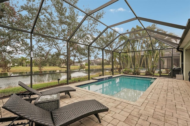 view of pool with a lanai, a water view, and a patio