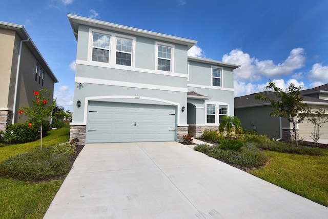 view of front of house featuring a front yard and a garage