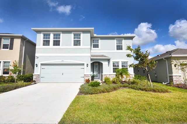 view of front of home featuring a front lawn and a garage