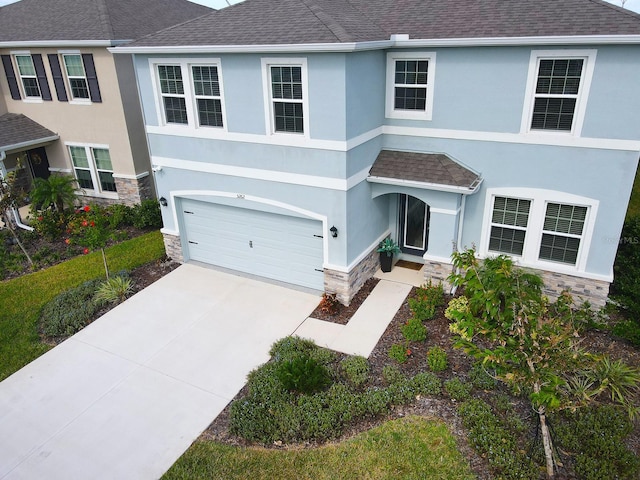 view of front of property with a garage