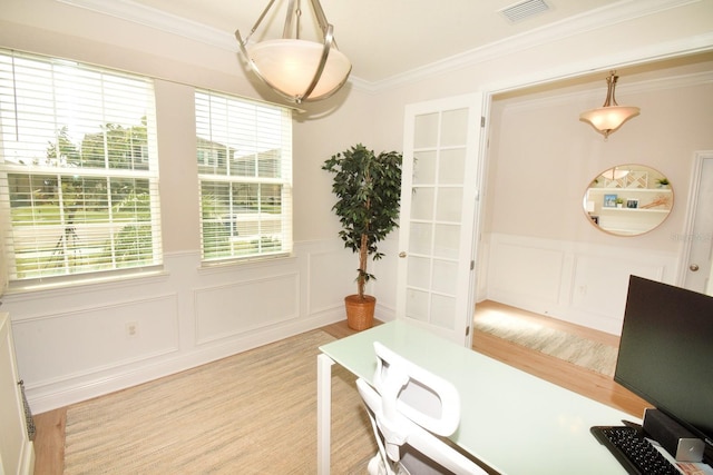 office area featuring french doors, light wood-type flooring, and ornamental molding