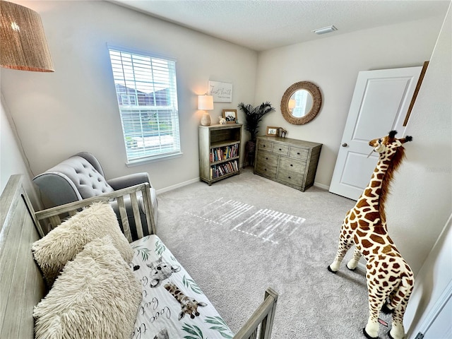 living area with a textured ceiling and light colored carpet