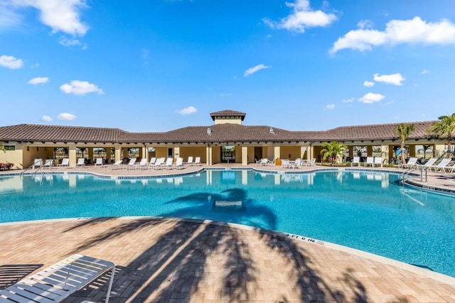 view of swimming pool with a patio area