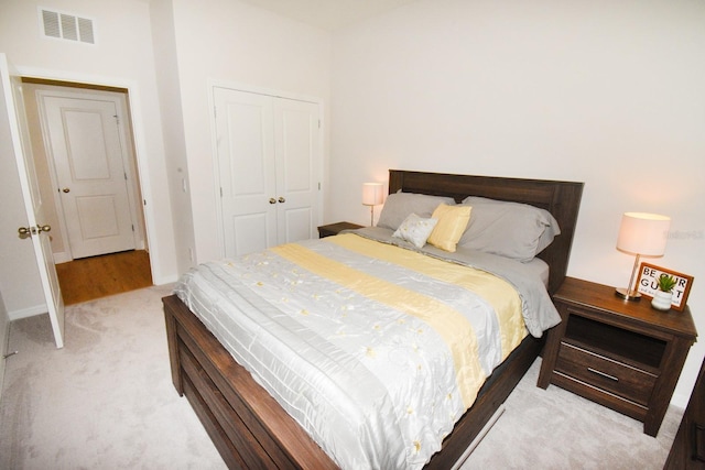 carpeted bedroom featuring a closet