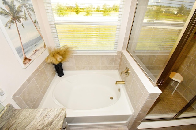 bathroom with independent shower and bath